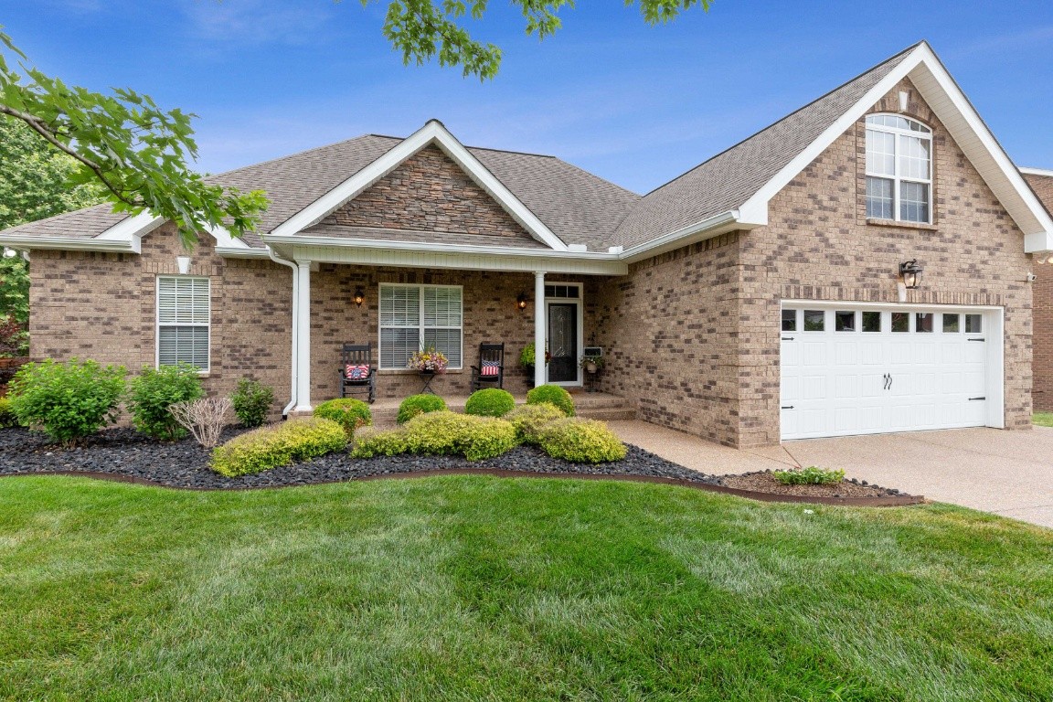 52 Abbey Road Lebanon, TN 37090 - Photo 2 of 40 a front view of a house with a garden and plants