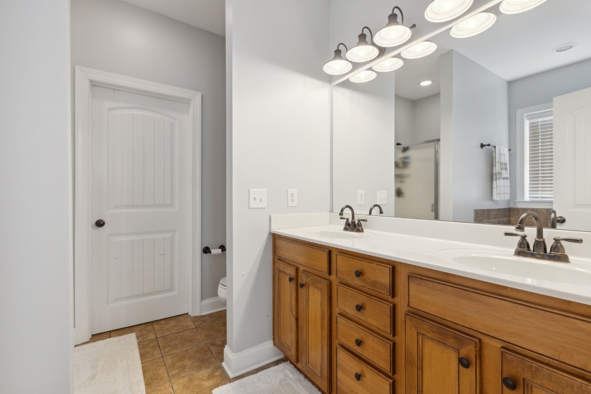 52 Abbey Road Lebanon, TN 37090 - Photo 24 of 40 a bathroom with a sink vanity and a mirror