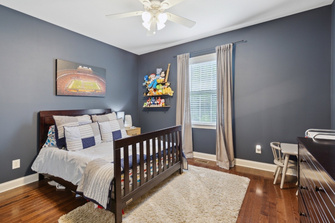52 Abbey Road Lebanon, TN 37090 - Photo 29 of 40 a bedroom with a bed and wooden floor