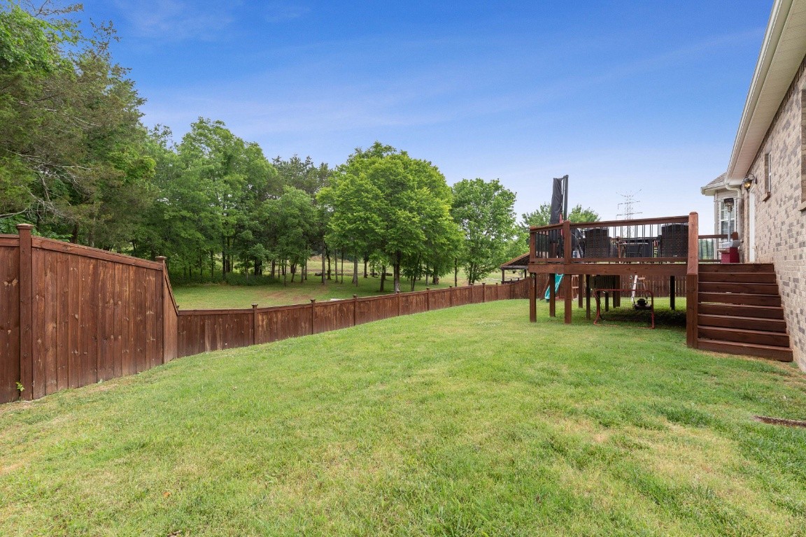 52 Abbey Road Lebanon, TN 37090 - Photo 37 of 40 a backyard of a house with table and chairs