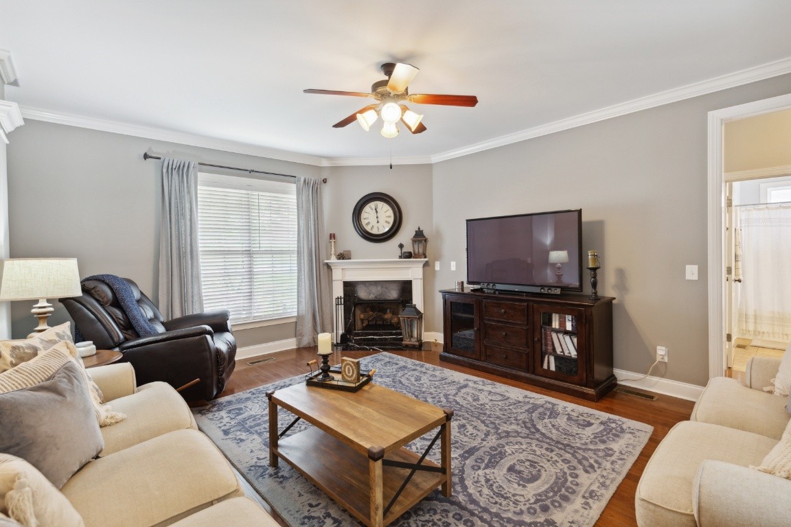 52 Abbey Road Lebanon, TN 37090 - Photo 8 of 40 a living room with furniture a fireplace and a flat screen tv