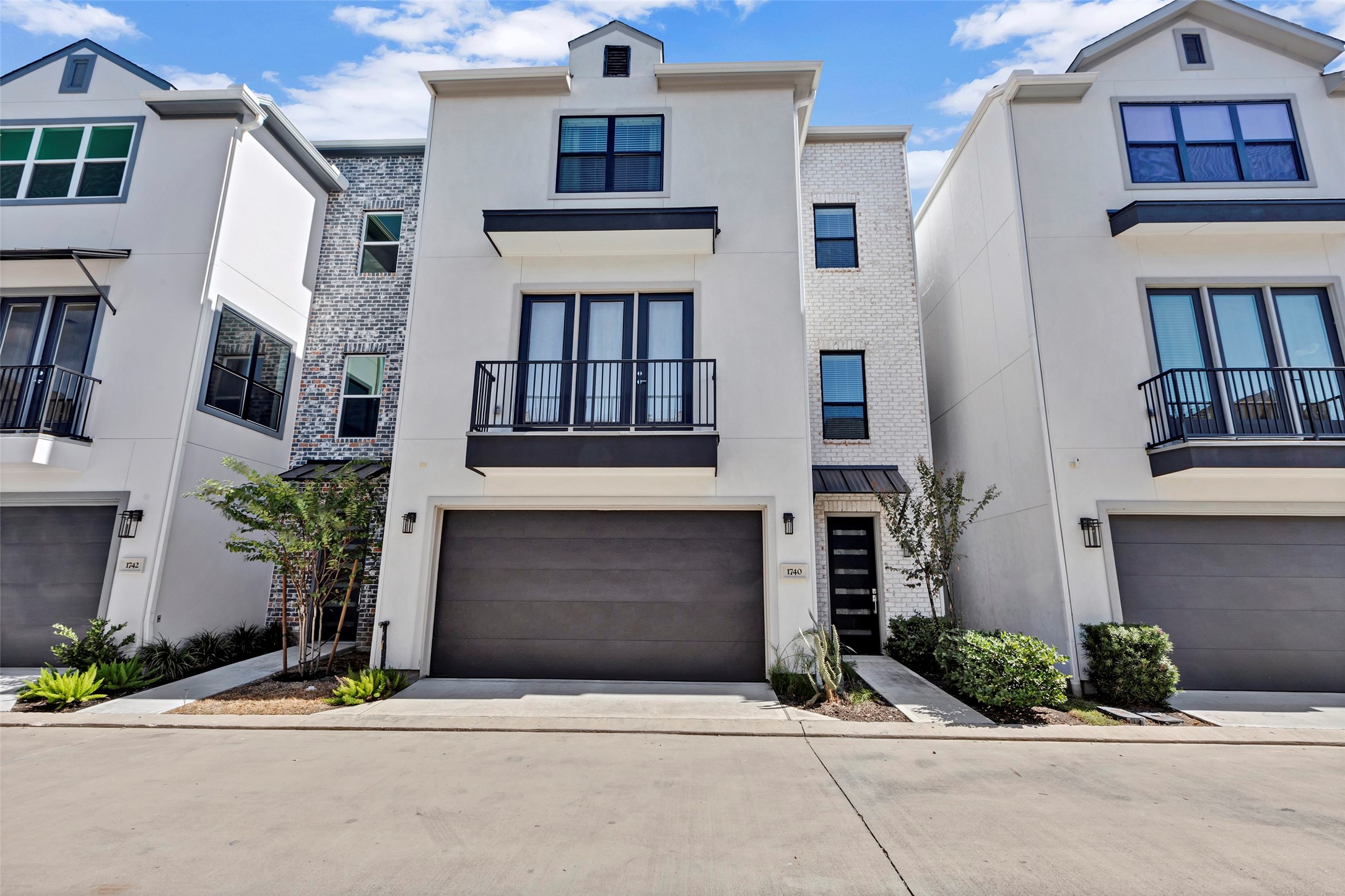 1740 Ojeman Point Lane Houston, TX 77055 - Photo 1 of 20 a front view of a house with garage