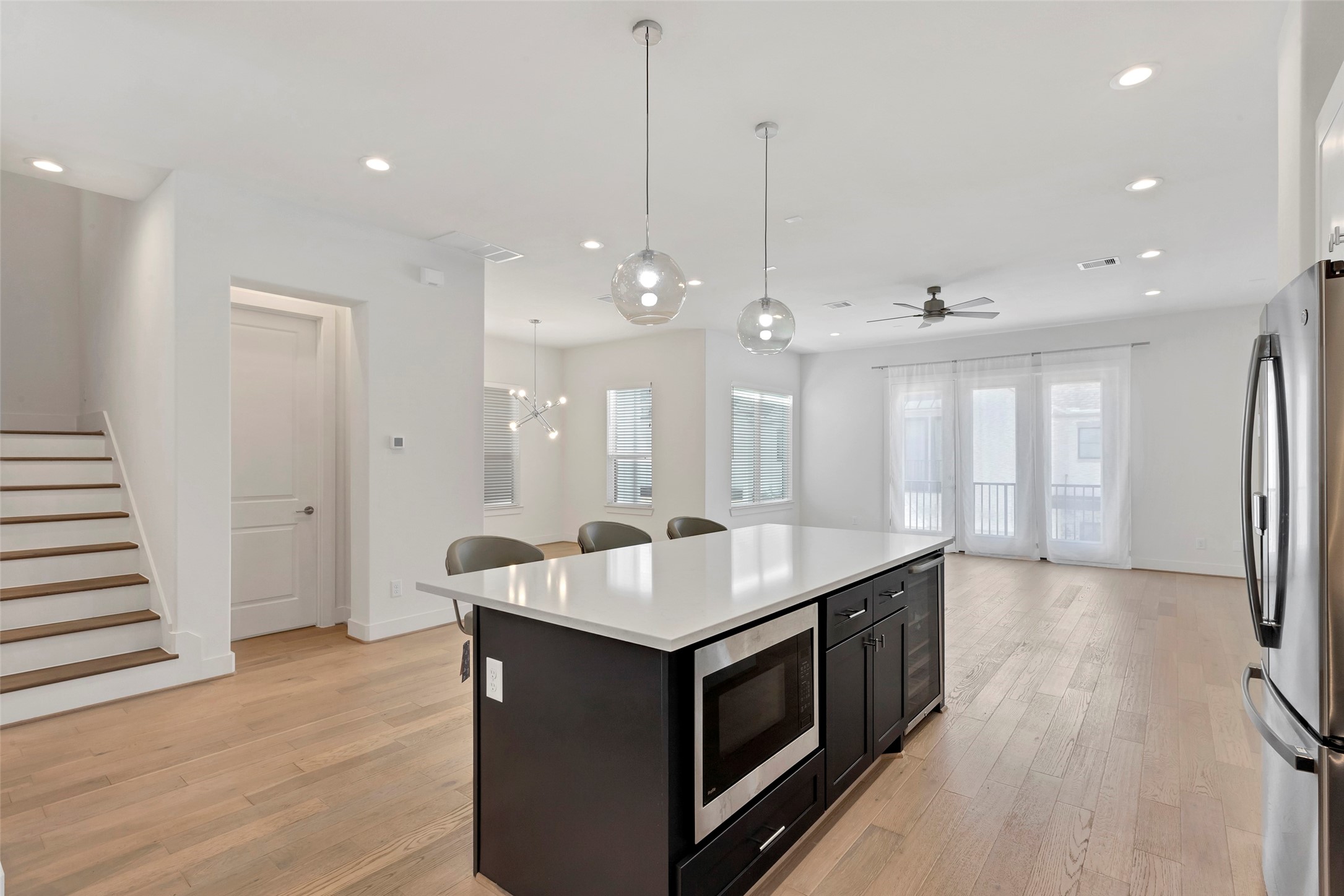 1740 Ojeman Point Lane Houston, TX 77055 - Photo 13 of 20 a kitchen with a sink appliances and a wooden floor