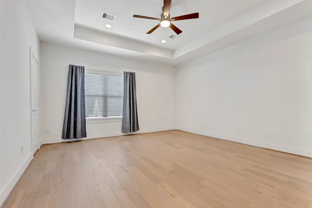 a spacious bathroom with a shower sink and mirror