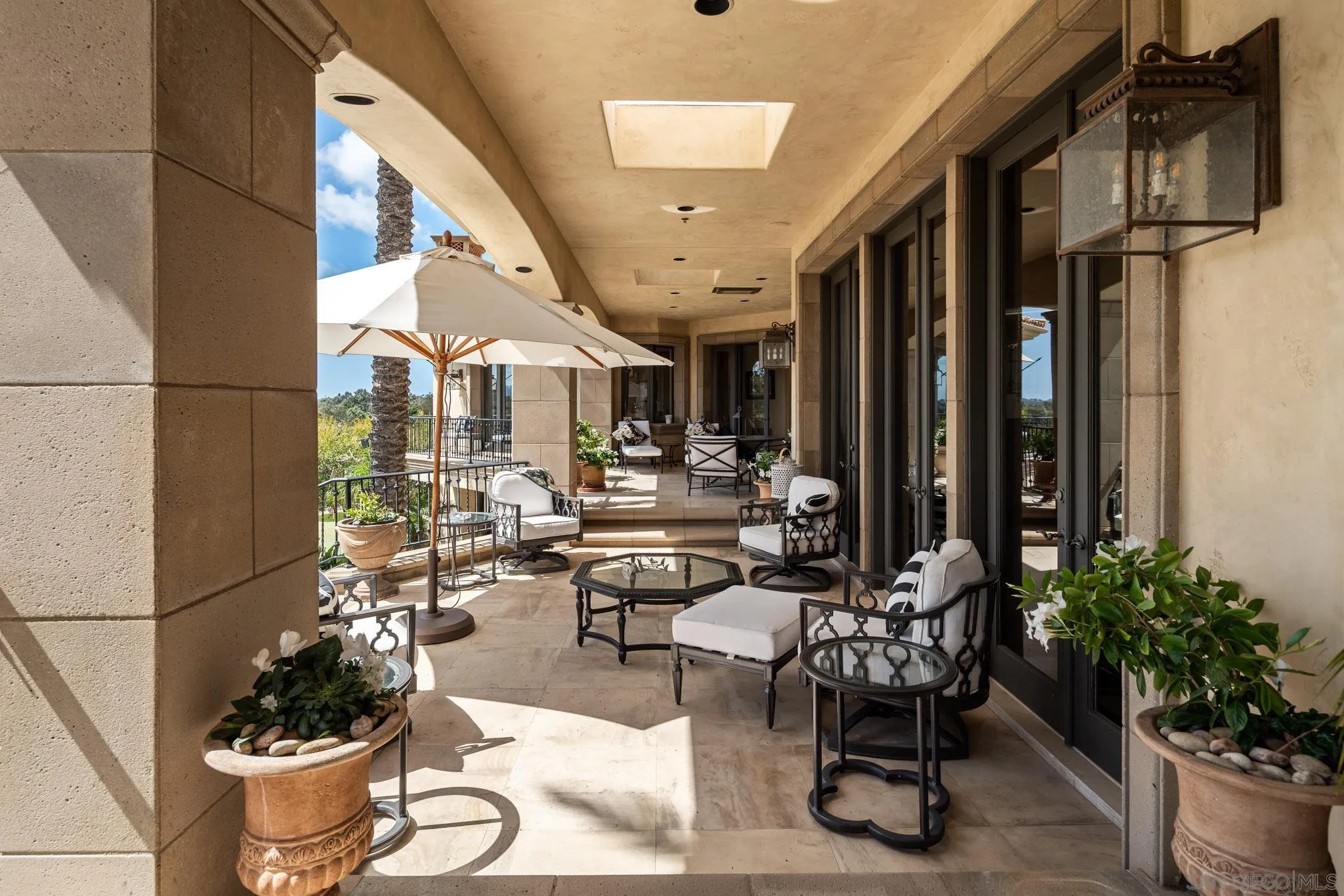 7756 St Andrews Road Rancho Santa Fe, CA 92067 - Photo 26 of 46 a lobby with furniture and potted plants