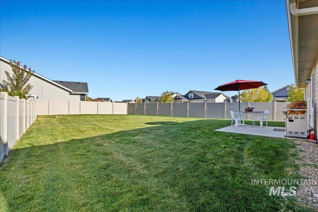 3174 North Greengate Way Star, ID 83669 - Photo 20 of 35 Fenced backyard featuring a patio