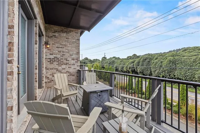 a view of balcony with furniture
