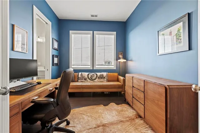 a bedroom with furniture and a window