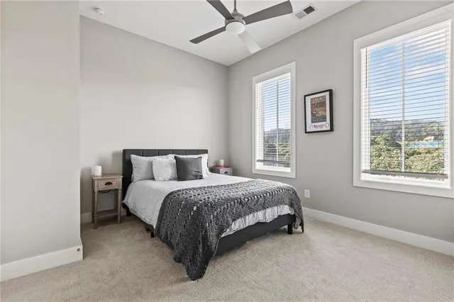 a bed room with a bed and a window