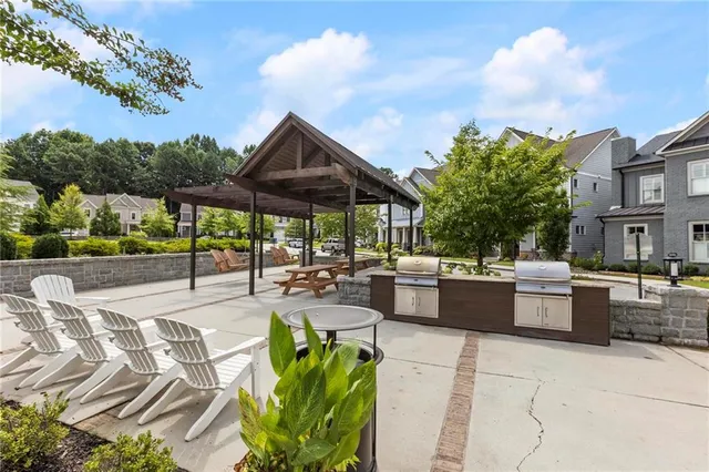 a view of a backyard with sitting area and furniture