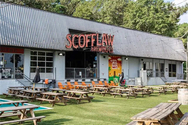 a view of a swimming pool with outdoor seating