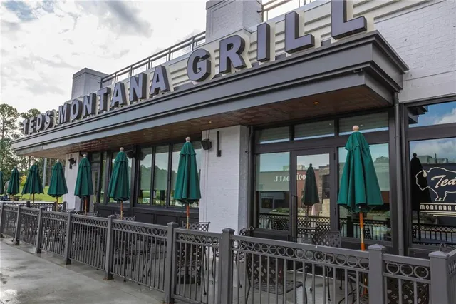 a view of a building with sitting area