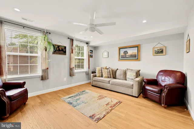 a living room with furniture rug and window