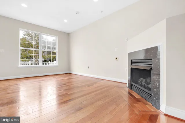 a view of kitchen with microwave and cabinets