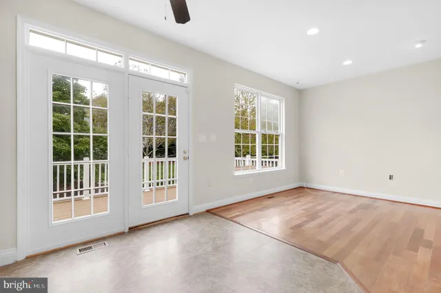 a kitchen with stainless steel appliances granite countertop a stove a sink and a granite counter tops with wooden floors