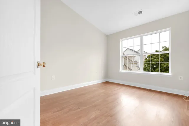 a view of an empty room with a balcony