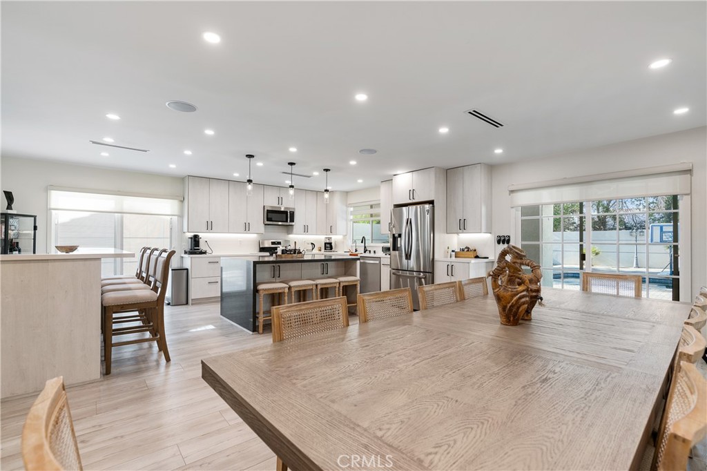 68920 Concepcion Road Cathedral City, CA 92234 - Photo 11 of 35 a kitchen with lots of counter top space and living room view
