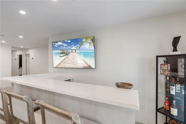 a bathroom with a sink a mirror and window