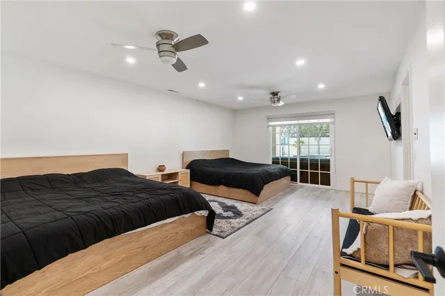 a bedroom with furniture and a window