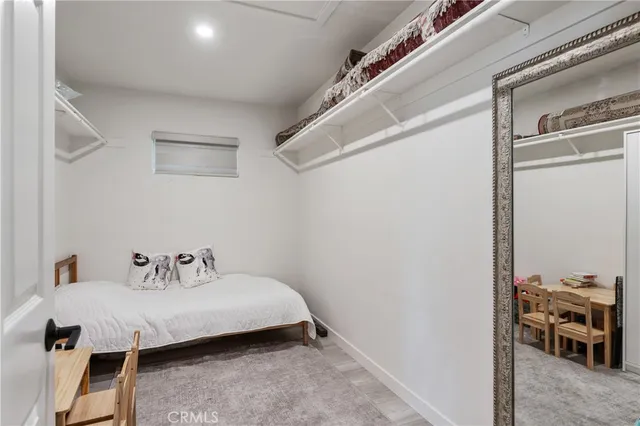 a bedroom with a bed and a table