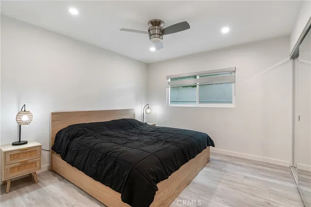 a bedroom with a bed and window