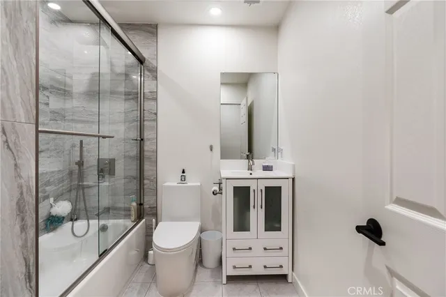 a bathroom with a toilet sink and shower