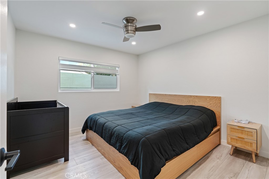 68920 Concepcion Road Cathedral City, CA 92234 - Photo 21 of 35 a bedroom with a bed and wooden floor