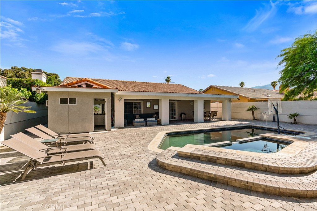 68920 Concepcion Road Cathedral City, CA 92234 - Photo 25 of 35 a view of house with swimming pool and furniture