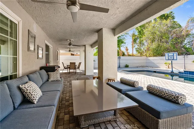 a living room with furniture and a rug