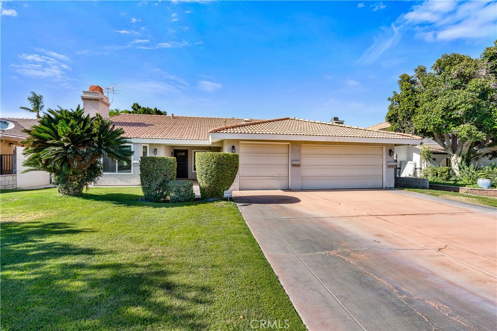 68920 Concepcion Road Cathedral City, CA 92234 - Photo 3 of 35 a front view of a house with a garden