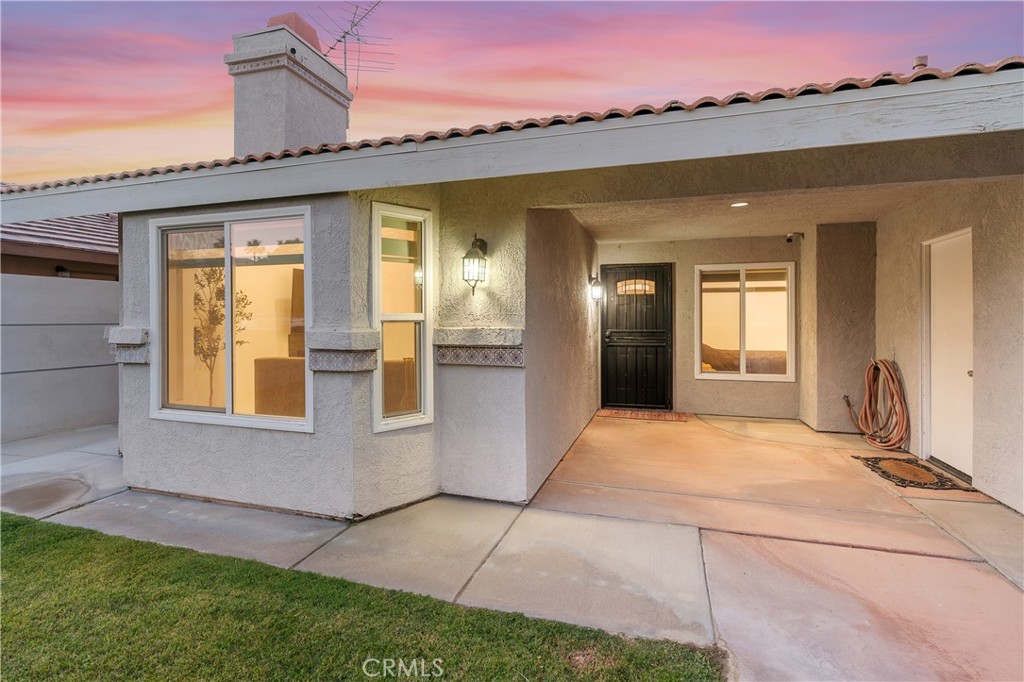 68920 Concepcion Road Cathedral City, CA 92234 - Photo 31 of 35 a front view of a house with a garden