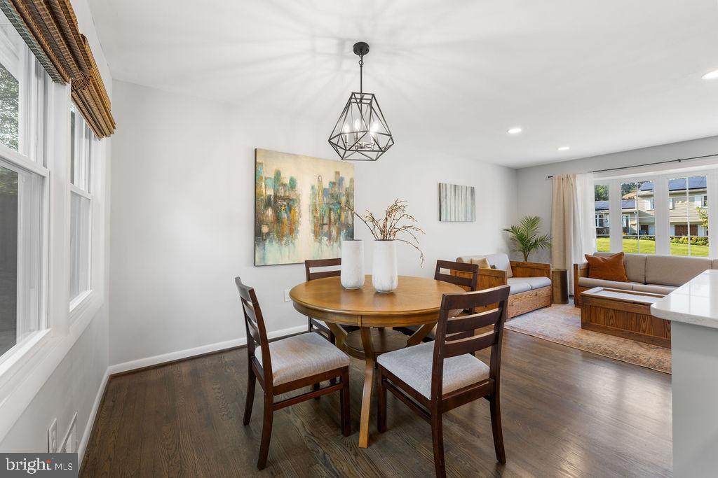 3018 Kramer Street Silver Spring, MD 20902 - Photo 10 of 38 a view of a dining room with furniture wooden floor and a chandelier
