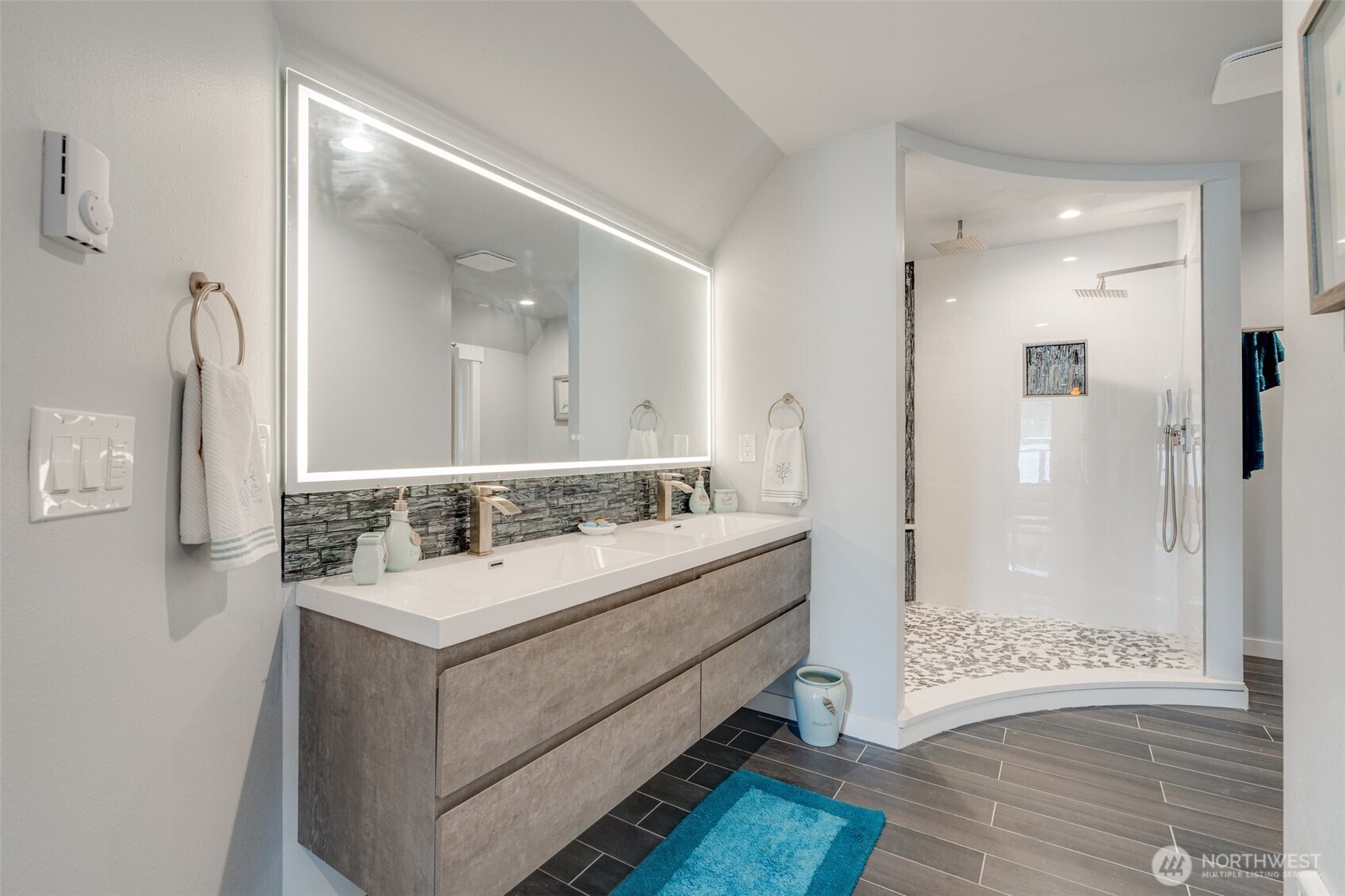 5341 South Bercot Road Freeland, WA 98249 - Photo 23 of 37 a bathroom with a sink mirror and a shower