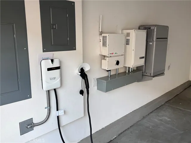 a room with gym equipment and a view of living room