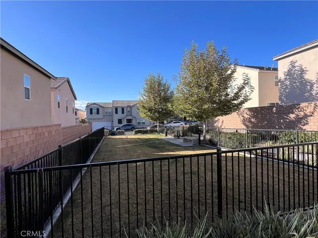 a sign board with buildings in the background