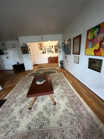 a living room with couch and a flat screen tv