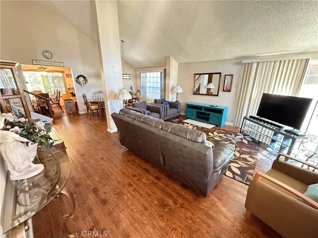 a living room with furniture or couch and a flat screen tv