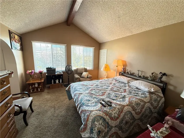 a bed sitting in a room next to a window