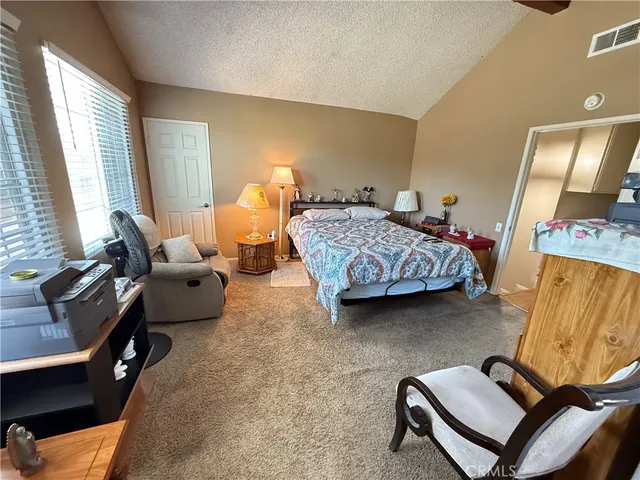 a bedroom with furniture and a window