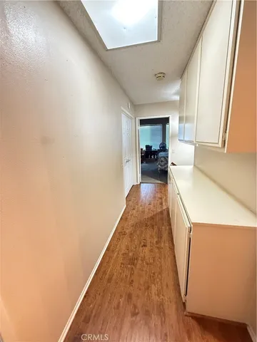 a view of a kitchen with a sink and cabinets