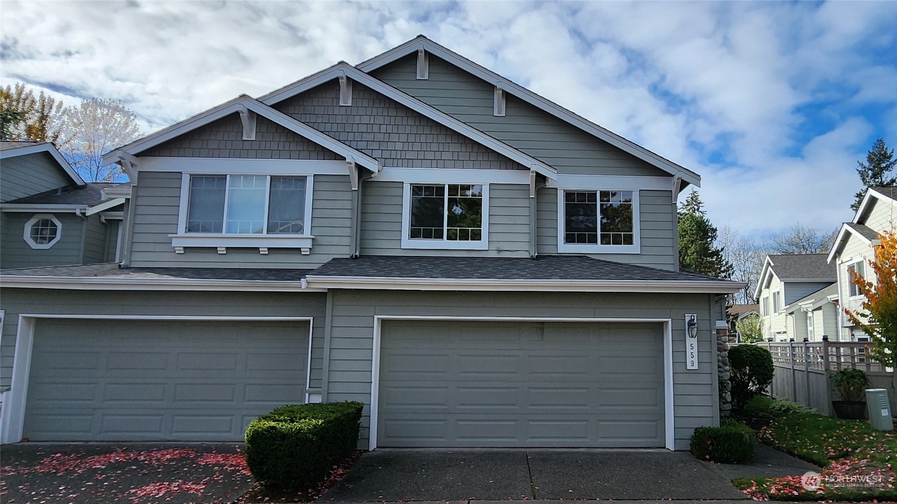 559 Elma Place Northeast Renton, WA 98059 - Photo 1 of 30 a front view of a house with garage