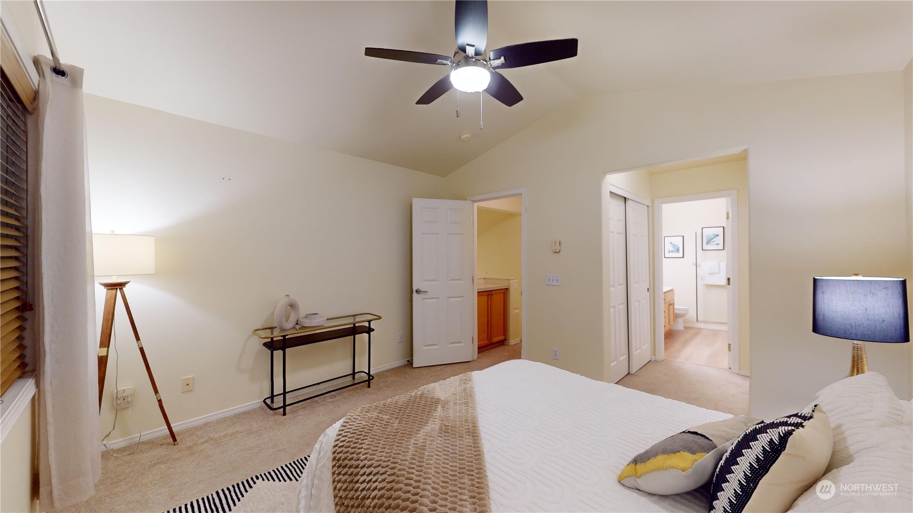 559 Elma Place Northeast Renton, WA 98059 - Photo 19 of 30 a bedroom with a bed and a chandelier