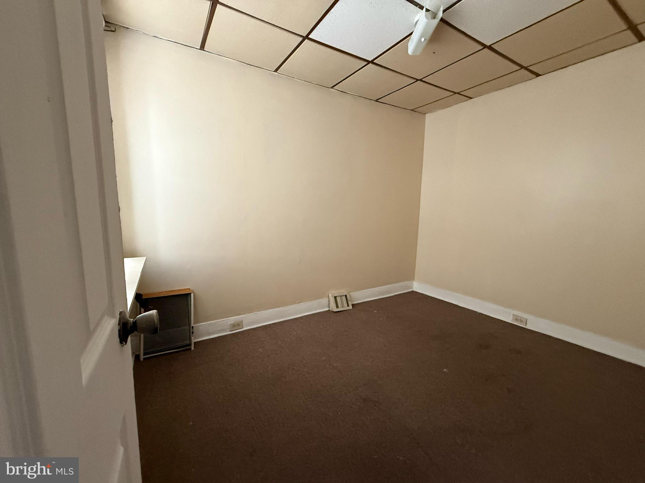 1603 South Dover Street Philadelphia, PA 19145 - Photo 4 of 12 en empty room with a empty space and a window