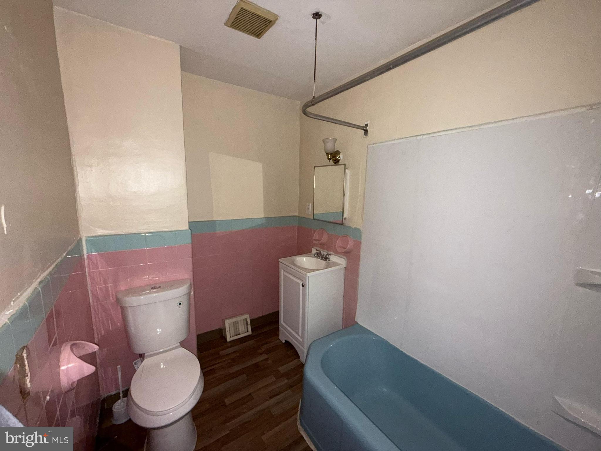 1603 South Dover Street Philadelphia, PA 19145 - Photo 8 of 12 a bathroom with a toilet and a shower