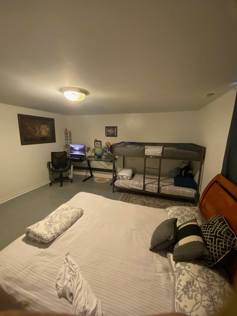 2944 Harlem Avenue, Unit 3 Riverside, IL 60546 - Photo 13 of 15 a bedroom with a bed and a chair