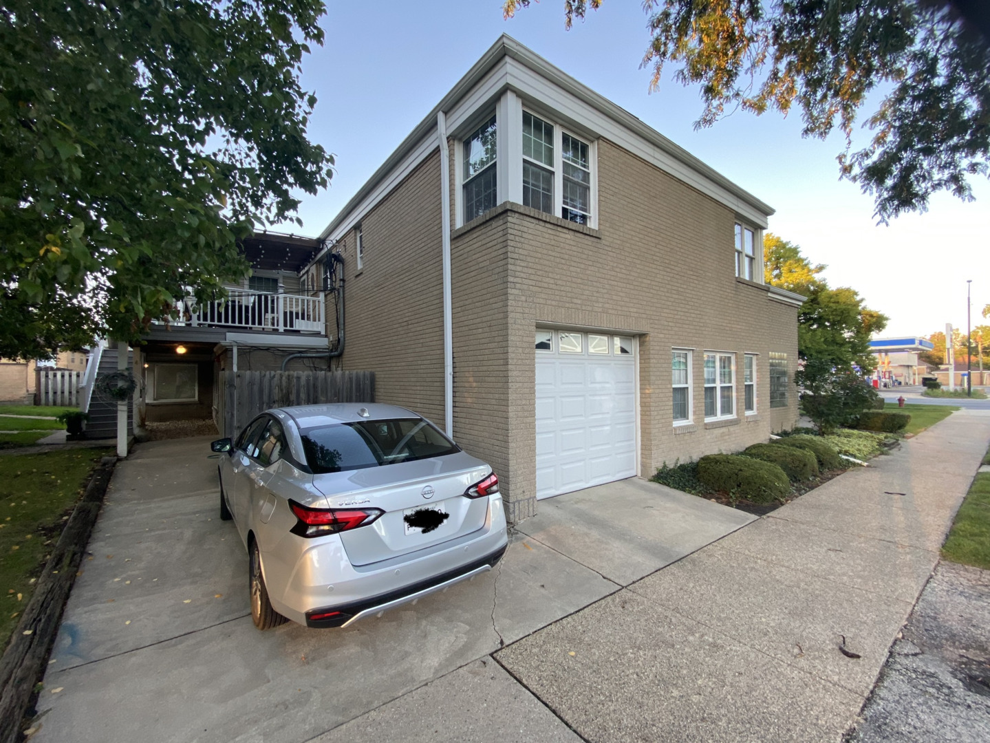 2944 Harlem Avenue, Unit 3 Riverside, IL 60546 - Photo 3 of 15 a car parked in front of white house