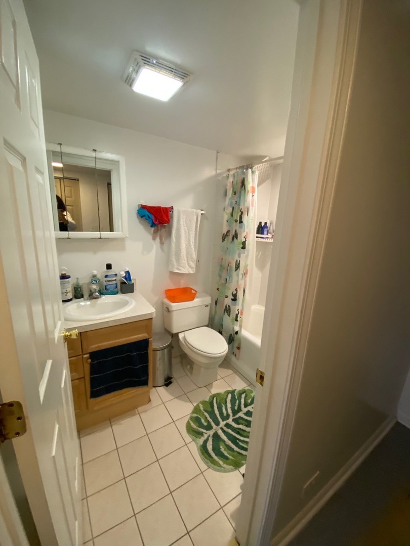 2944 Harlem Avenue, Unit 3 Riverside, IL 60546 - Photo 10 of 15 a bathroom with a sink toilet and shower