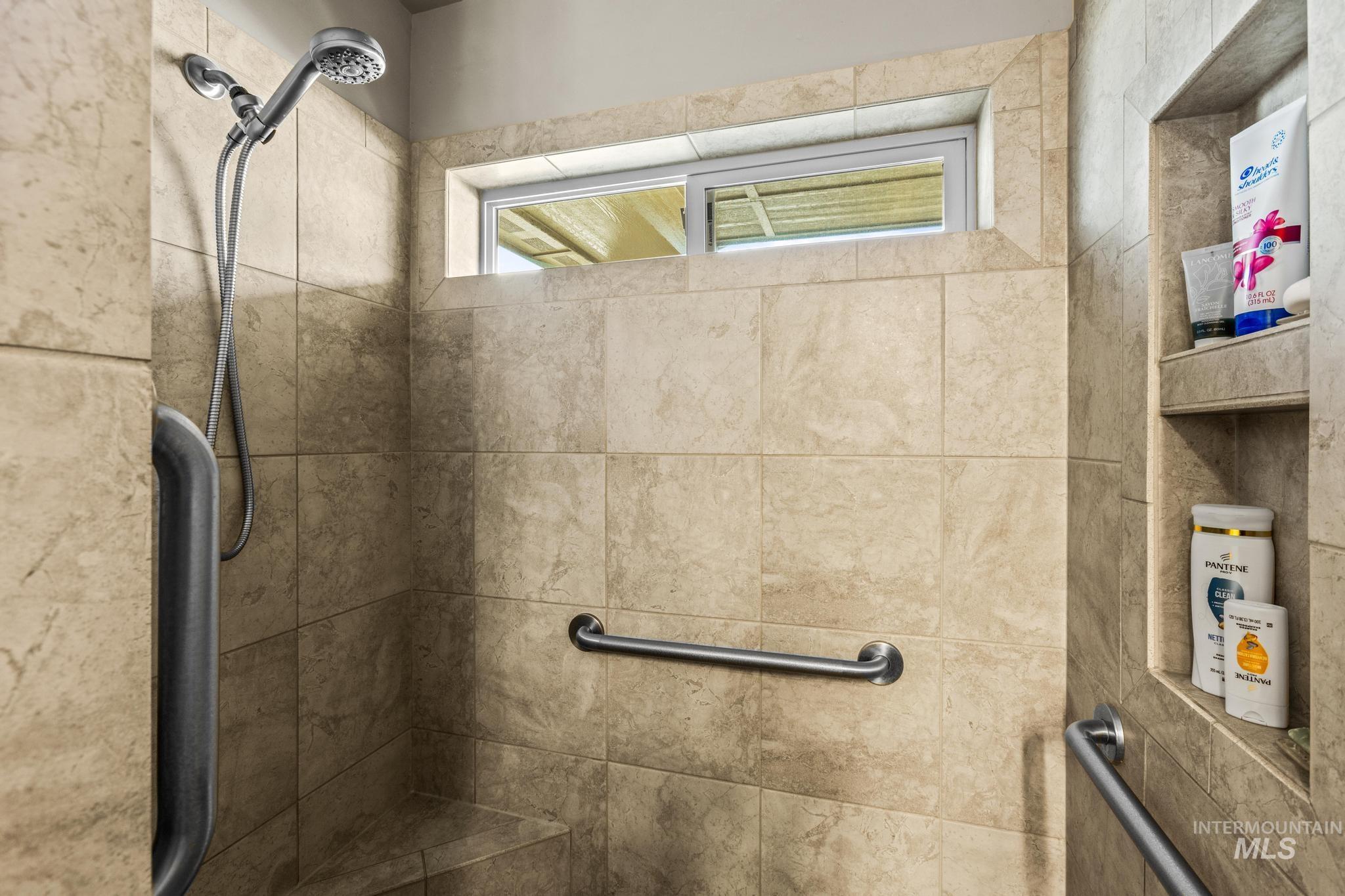 5832 West Rotherham Drive Eagle, ID 83616 - Photo 23 of 42 Bathroom featuring a tile shower