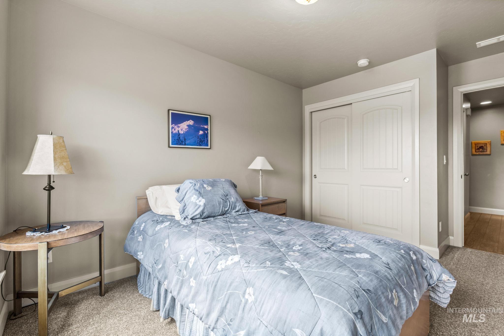 5832 West Rotherham Drive Eagle, ID 83616 - Photo 25 of 42 Bedroom featuring light colored carpet and a closet