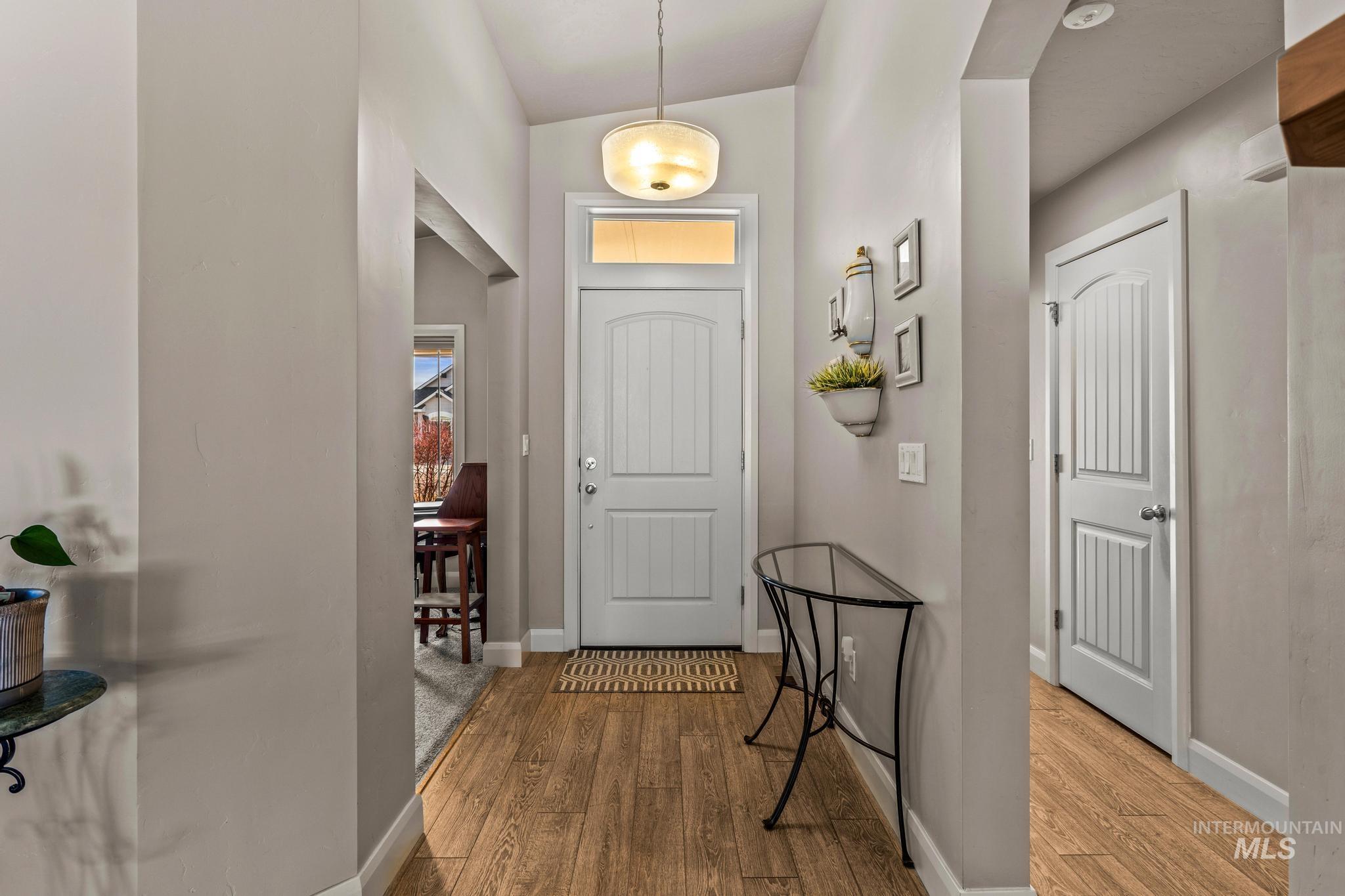 5832 West Rotherham Drive Eagle, ID 83616 - Photo 3 of 42 Foyer entrance with wood finished floors and baseboards